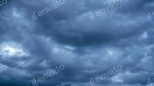 Preview: Overcast sky with dark clouds. Dark sky before a thunder-storm.