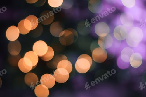 Preview: Abstract background with gold and purple bokeh lights