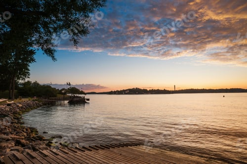 Preview: Dramatic clouds over rural lake