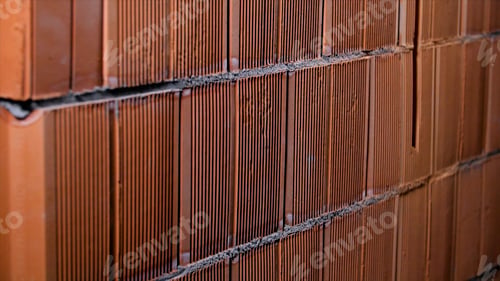 Preview: Close-up of background of red brick wall made of blocks. Stock footage. Background of new brickwork