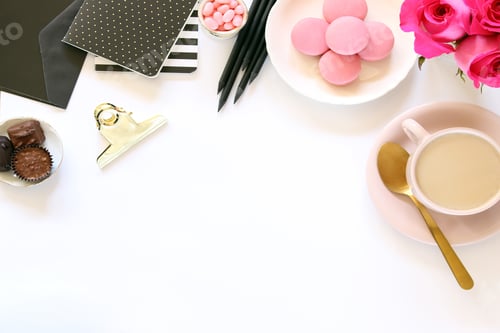 Preview: Black and pink desktop with office supplies and food and drink