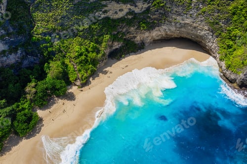 Preview: Kelingking beach, Nusa Penida, Bali, Indonesia. Aerial view on the sea and rocks.