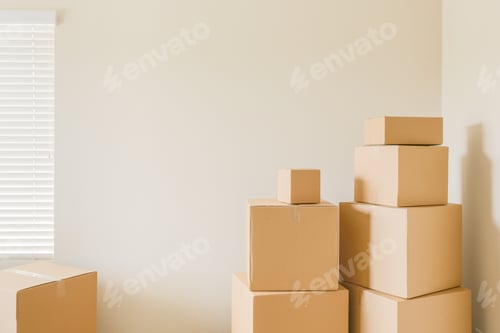 Preview: Variety of Packed Moving Boxes In Empty Room