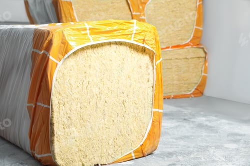 Preview: Packages of thermal insulation material in room, closeup. Space for text