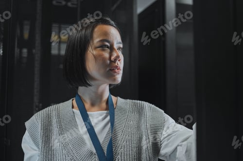 Preview: Serious, maintenance or IT woman in server room for analysis, engineer working in data center. Thin