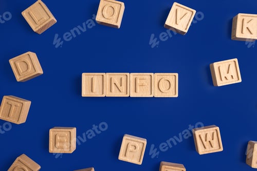 Preview: Word info is written on a wooden cubes structure. Blocks on colorful background. Selective focus.