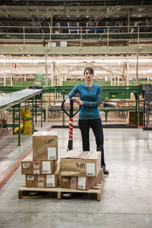 Preview: A caucasian female warehouse worker in a distribution warehouse.