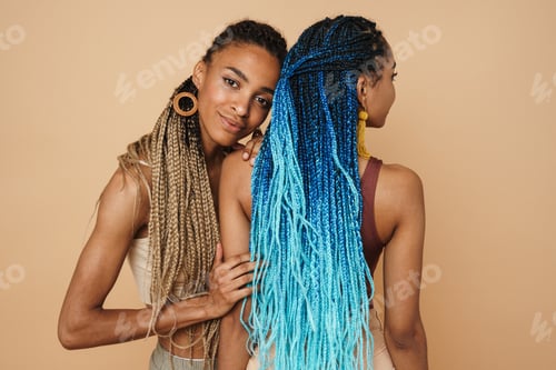 Preview: Young black two women hugging while posing on camera