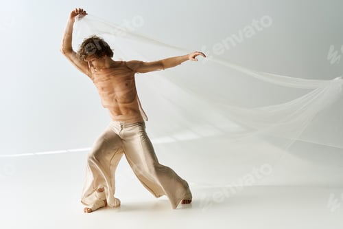 Preview: Curly young dancer expresses emotion through movement in contemporary studio setting