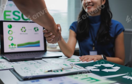 Preview: Businesswomen shaking hands over esg environmental conservation and sustainability agreement