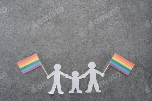 Preview: white paper cut same sex family with rainbow flags on grey background, lgbt concept