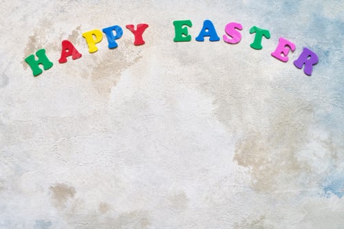 Preview: Easter background. Colorful letters forming words HAPPY EASTER on watercolor background. Copy space