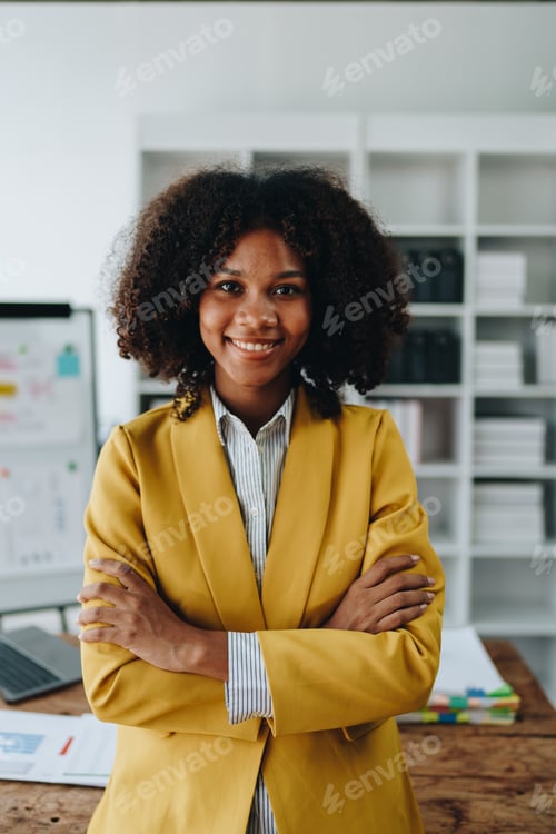 Preview: American African business woman using document, computer laptop, calculator, paperwork, documents