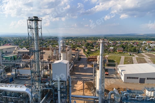 Preview: Aerial view of wood processing factory with stacks of lumber at plant manufacturing yard.