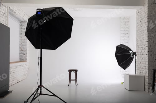 Preview: Clear white cyclorama. Light background with with professional lighting equipment. Plain wall empty