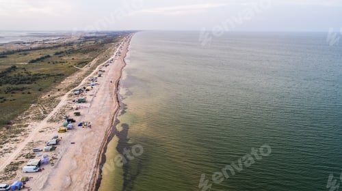 Preview: Coastal Camping on Sandy Beach with Calm Waters