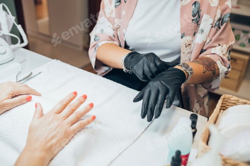 Preview: Manicurist Working On A Woman's Nails