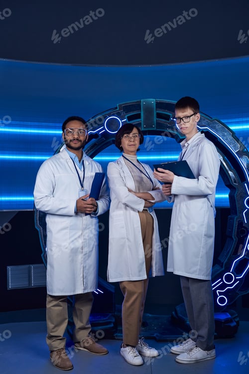 Preview: futuristic laboratory, multiethnic team of scientists looking at camera near high-tech equipment