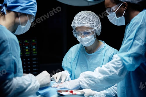 Preview: Surgeons in Masks Perform Surgery in Operating Room