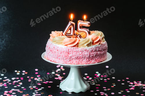 Preview: Celebration cake adorned with candles marking 45 years of life and joy