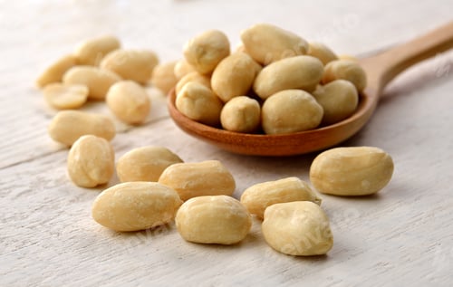 Preview: peanut in the spoon on white wooden