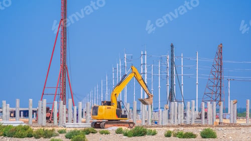 Preview: Excavator with pile driver are installing precast concrete piles for industrial building foundation