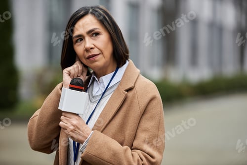 Preview: Confident Woman Reporting News Outdoors in the City