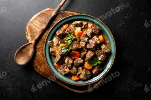 Preview: Beef meat goulash with carrot and onion, beef and carrot stew, top view
