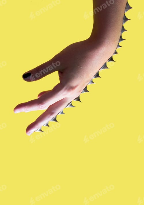 Preview: Spikes on hand on yellow background