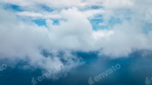 Preview: A serene view of clouds meeting the ocean off the coast of Taiwan during a sunny day