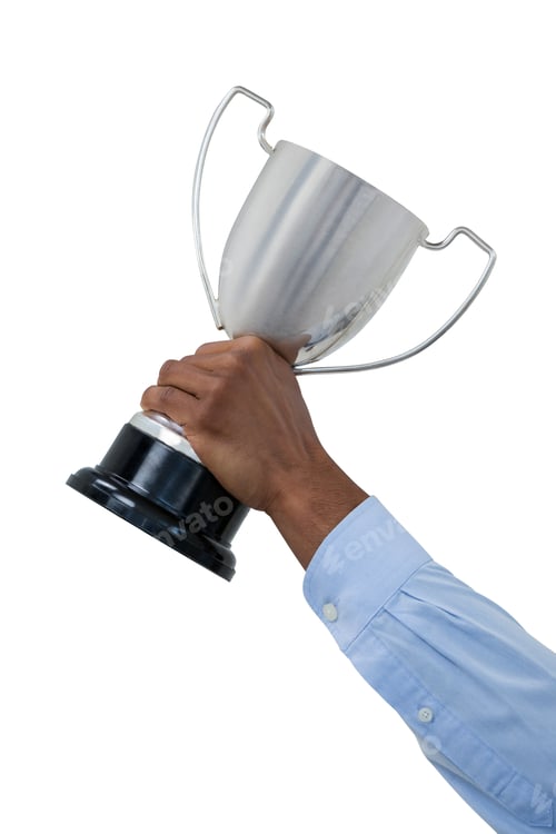 Preview: Hand of businessman holding trophy