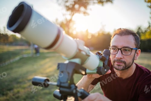 Preview: Amateur Astronomer Looking At The Sky With A Telescope.