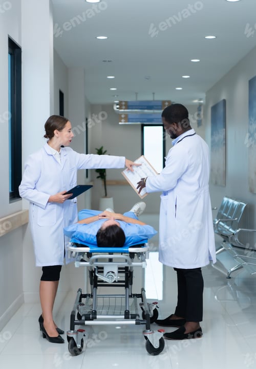 Preview: Medical professor and intern looking at an MRI of a patient
