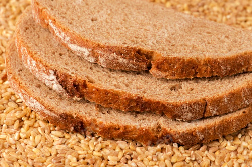 Preview: Sliced Bread Stacked on Bed of Wheat Kernels