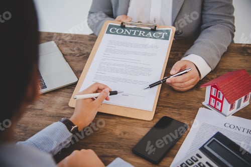 Preview: House signers signing signature loan document to home ownership with real estate agents ownership