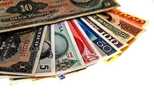 Preview: Overhead shot of paper bills laid in a white surface