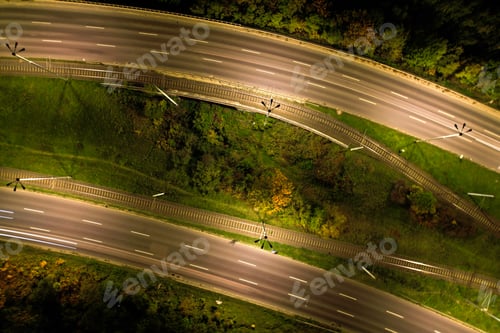 Preview: Top down view to road. Romantic night aerial photo of cars traveling. The light on the road at night