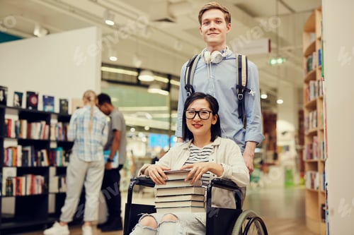 Preview: Boy helping groupmate in wheelchair