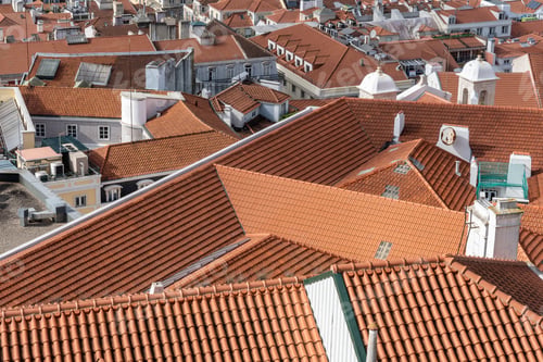 Preview: Aerial shot of rooftops of city buildings with red shingles