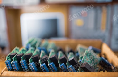 Preview: Close-up electric green embedded microcircuits in production