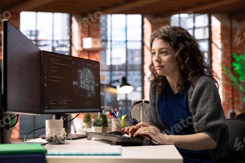 Preview: Female IT engineer doing maintenance on artificial intelligence systems
