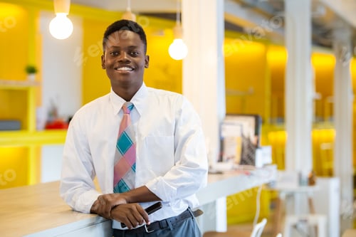 Preview: portrait young businessman handsome african American black skin smiling looking at camera.