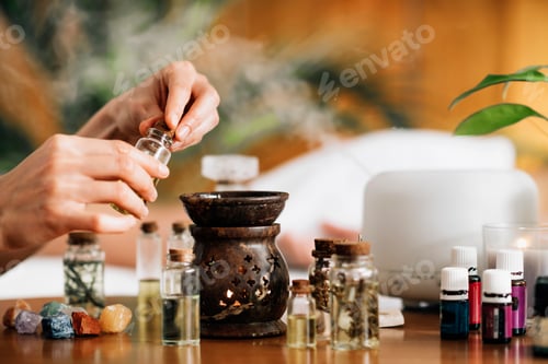 Preview: Ayurveda Aromatherapy Massage, Pouring Aromatic Oil in Essential Oil Diffuser