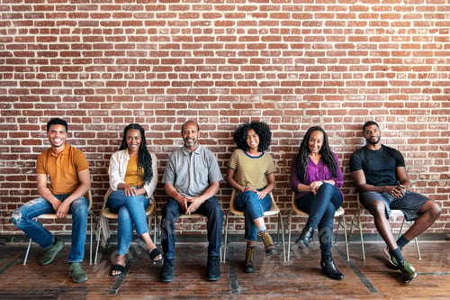 Preview: Diverse people sitting on a chair