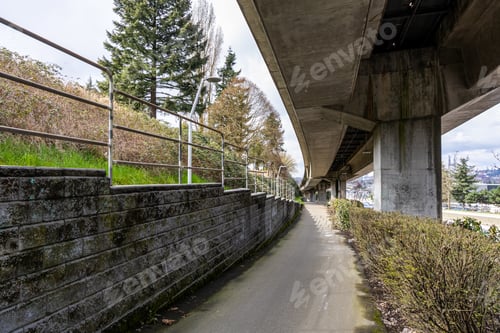 Preview: Paved Pathway with Urban Infrastructure and Scenic Surroundings in Vancouver, BC, Canada