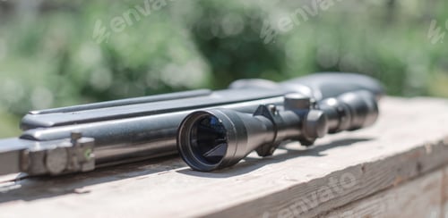 Preview: Close-up optical sight of a rifle. A rifle with an optical sight. Selective focus.