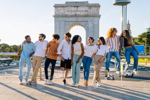 Preview: Group of young people leaning on railing in a city