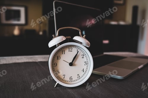 Preview: The clock on the computer background. Time management and balancing life concept.