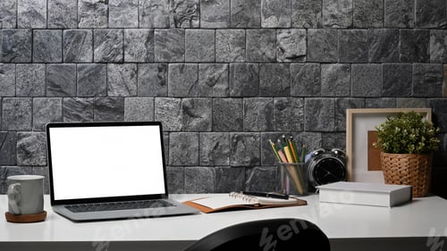 Preview: Designer workplace with laptop computer, coffee cup, stationery and houseplant on white table.