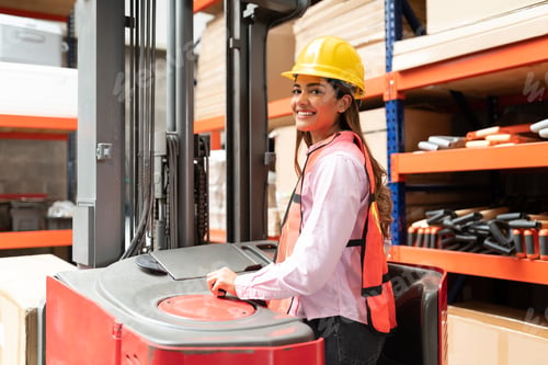 Preview: Side View Of Employee With Machinery At Factory